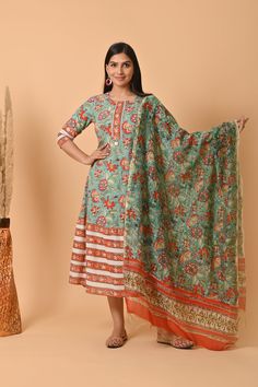 Crafted with the finest Indian cotton, this exquisite dress is a celebration of traditional craftsmanship and contemporary style. Each intricate block print design is a testament to the rich heritage of Indian textiles, specifically hailing from the colorful region of Rajasthan. The lightweight and breathable cotton fabric make this dress a perfect choice for warm summer days, ensuring both comfort and style in one elegant piece. The Jaipuri print adorning the dress brings alive the vibrant colors and floral patterns that are characteristic of this culturally rich region. This stunning cotton dress is more than just clothing; it's a statement piece that bridges the gap between tradition and modern fashion. Whether you're looking for a standout ensemble to gift your girlfriend, mom, sister, Cotton Anarkali Dress For Traditional Ceremonies, Traditional Cotton Dresses With Drape, Multicolor Dresses With Traditional Patterns For Diwali, Traditional Drape Cotton Dress With Traditional Patterns, Festive Cotton Dress With Traditional Drape, Festive Traditional Drape Cotton Dress, Traditional Chanderi Dresses With Patterns, Traditional Chanderi Dresses With Traditional Patterns, Traditional Dresses With Printed Motifs For Eid