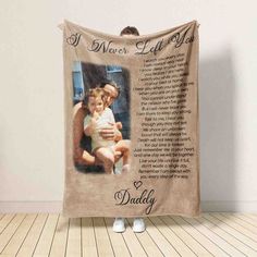 a personalized blanket with an image of a man holding a baby and the words i never