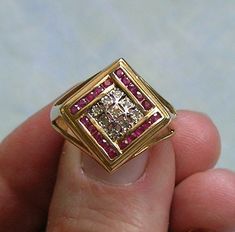 "Vintage 14k Gold, Diamond and Ruby Ring, 14K Ruby and Diamond Ring, Ring With Rubies and Diamonds  Beautiful vintage 14k yellow gold, diamond and ruby ring circa the 1980's.  The ring features 20 channel set rubies that are 1 pt a piece and 9 diamonds that are 1/2 pt a piece.  The ring has square shoulders with open sides.  The ring is marked 14K with another hallmark that I cannot make out.  A very pretty vintage ring.  The ring is a size 8. ♦ Age - Approximately 1980's ♦ Metal/Material - 14k Formal 14k Gold Ruby Ring With Single Cut Diamonds, Unique 14k Gold Diamond Ring For Formal Occasions, Square Shoulders, Diamond And Ruby Ring, Rubies And Diamonds, Ruby And Diamond Ring, Ruby Diamond, Channel Set, Multi Stone Ring