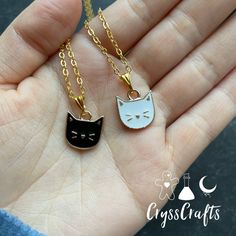 Are you a crazy cat lady? These kitty cat charm necklaces are the puuurfect thing! Cat charms come in black or white & hung on a gold toned chain. Can’t pick just one? Wanna get one for a friend? Select the 3rd option to buy the necklaces as a set. Set will come with one black and one white cat charm necklace. Chain is approx 18inches and has a standard lobster claw clasp. Trendy Cat Design Jewelry For Gift, Trendy Cat Design Jewelry Gift, Metal Cat Design Necklace For Gift, Trendy Black Jewelry With Cat Design, Cute Gold Necklace With Cat Design, Gold Cat Ears Jewelry Gift, Gold Cat Ears Jewelry As Gift, Gold Cat Ears Jewelry For Gifts, Gold Cat Ears Jewelry For Gift