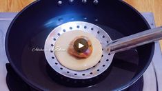 a video demonstrating how to make an appetizer in a frying pan on the stove