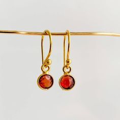 Add some subtle but noticeable color to your everyday look with these exquisite Bezel Gemstone Drop Earrings! Featuring petite faceted gemstones bezel-set and suspended from gold-filled ear wires, you can find the perfect birthstone for you or someone special in the twelve birthstones of the year. An ideal personalized gift for any occasion! -- bezel charm: 6mm French hook ear wires 14k gold filled Dainty 14k Gold Filled Birthstone Earrings, Everyday 14k Gold Filled Birthstone Earrings, Dainty Gold Birthstone Earrings, Faceted 14k Gold Filled Yellow Gold Earrings, Dainty Faceted Yellow Gold Earrings, Everyday Gold Plated Birthstone Earrings, Dainty Gold-plated Birthstone Earrings, Dainty Faceted Everyday Earrings, 14k Gold Filled Faceted Earrings For Gift