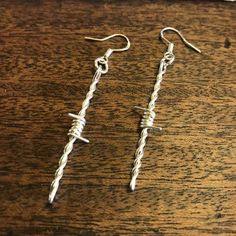 Sterling silver barbed wire earrings on sterling silver hooks. 2 1/2 inches long. Barbed Wire Jewelry Diy, Western Wire Jewelry, Nickel-free Silver Wire Jewelry, Silver Wire Dangle Jewelry, Silver Dangle Wire Jewelry, Silver Dangle Jewelry Made Of Wire, Barbed Wire Jewelry, Barbed Wire Earrings, Homemade Jewerly