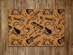 a cork board with musical instruments on it and wood planks in the back ground