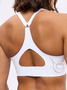 Features: Square neckline Laser cut detailing Built in molded bust pad (not removable) Details: Fabric: Airbrush (Nylon/Spandex) Medium to High Support Level Med Line Introducing our Airbrush Laser Cut BTC Sports Bra, featuring laser-cut details at the front and back bodice. Built-in molded pads provide enhanced support, while adjustable shoulder straps ensure a customizable fit. The bottom band features a bra clasp with three adjustment levels, with an additional bra clasp extender piece included separately in the polybag. A keyhole detail at the center back adds a stylish touch. Hidden thick elastic inside the hem offers high support, and the nude lining prevents see-through in the laser-cut holes. Bra Clasp, Cloud Fabric, Bra Size Guide, White Sports Bra, Jogger Shorts, Black Sports Bra, Short Shirts, Square Necklines, Sports Bra Sizing