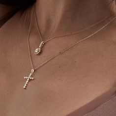 The Forever Cross Necklace is a universal symbol of faith and love. It features a delicate cross pendant crafted with solid gold, studded with sparkling round diamonds, and hangs from a fine gold chain. Whether you wear it alone or layer it with other necklaces, this pendant adds elegance and grace to any outfit. Golden Cross, Diamond Cross Necklace, Replica Jewelry, Diamond Cross Necklaces, Catholic Jewelry, Cross Chain, Vs Diamond, Diamond Cross, Diamond Settings