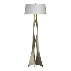 a floor lamp with a white shade on it's side and a metal base