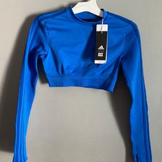 Ivy Park X Adidas Rodeo Collection Long Sleeve Crop Top Glory Blue Size Small. 100% Authentic. Sold Out Gorgeous Top!! Code: 024 Adidas Fitted Long Sleeve Activewear, Adidas Fitted Activewear For Spring, Adidas Blue Activewear For Spring, Adidas Long Sleeve Workout Top, Adidas Blue Activewear For Gym, Adidas Stretch Long Sleeve Tops, Adidas Stretch Tops For Gym, Adidas Blue Long Sleeve Tops, Blue Adidas Long Sleeve Tops