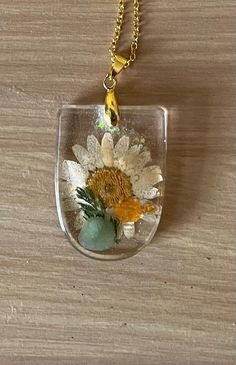 one off resin pendant with dried flower and tumbled crystal stones, on gold coloured chain. Golden Chain, Crystal Stones, Resin Necklace, Tumbled Stones, Resin Pendant, Dried Flower, Stones And Crystals, Pendant Necklaces, Dried Flowers