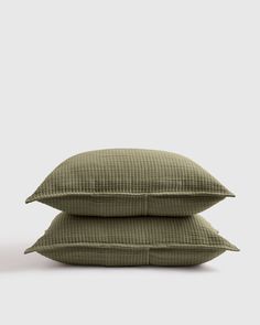 two pillows sitting on top of each other