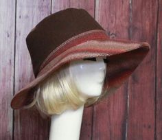 Wide Brim Sun Hat -Brown Wool with burgundy contrast print Inside black cotton band, the hat has a 2 section crown 3 1/2 " in length and a one piece 4" brim, and is lined in a cotton blend print. This hat is one size fits all and will fit 21" - 23" head size. Adjustable Curved Brim Bucket Hat For Fall, Adjustable Wide Brim Bucket Hat For Fall, Retro Curved Brim Hat For Fall, Adjustable Short Brim Bucket Hat For Fall, Adjustable Bucket Hat For Fall, Adjustable Bucket Sun Hat For Fall, Brown Wide Brim Fitted Hat, Brown Brimmed Fedora One Size, Adjustable Brown Hat With Curved Brim