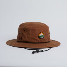 The Seymour is a super versatile boonie hat, perfect for fishing, camping, boating, or just hangin'. Made of a rich waxed canvas, with moisture wicking sweatband inside. Snaps up at both sides, with belt loops at side for attaching, and adjustable chin cord for a secure fit. Adjustable Canvas Sun Hat For Outdoor Use, Casual Wide Brim Bucket Hat For Adventure, Adjustable Wide Brim Bucket Hat For Adventure, Canvas Hat With Curved Brim For Outdoor Activities, Outdoor Canvas Bucket Hat With Short Brim, Brown Camping Hat, Waterproof Brown Hats For Outdoor Activities, Waterproof Brown Hat For Outdoor, Waterproof Brown Hat For Outdoor Activities