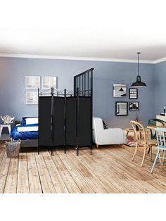 a living room with blue walls and wooden floors