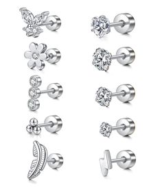 six pairs of earrings with different shapes and sizes, all in white gold or silver