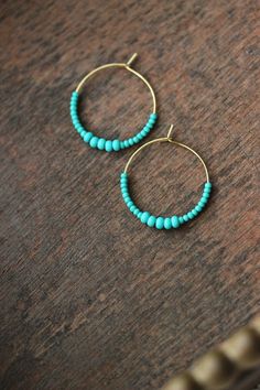 Minimalist summer earrings with turquoise green glass seed beads and gold tone stainless steel round hoop earrings. Earring hooks are from nickel free and lead free metal. Perfect jewelry for everyday wear or a great gift for someone special! Diameter of hoops is 25 mm Other earrings of my shop you can see here: https://www.etsy.com/shop/NaTavelli?section_id=13757927 Thanks for visit. Beads Earrings Gold, Everyday Earrings Simple, Turquoise Earrings Gold, Seed Beads Earrings, Stone Bead Jewelry, Minimalist Summer, Vert Turquoise, Summer Earrings, Beads Earrings