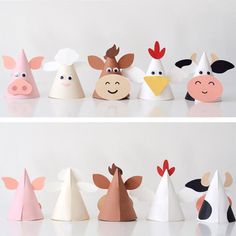 several paper hats with farm animals on them