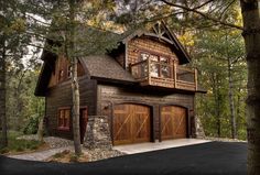 a two car garage in the middle of a wooded area