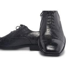 When it comes to achieving a perfect business-like persona, one of the most significant accessories is the shoes. These black leather shoes are the right choice for all the reasons. Firstly, the beautiful handiwork on the exterior gives them a unique touch. Secondly, being black, these shoes are as versatile as they get. Here’s a lot more about these brilliant men’s black Brogue Oxfords by the LeatherSkin Shop. Genuine leather official black formal shoes with a flexible style and design that only adds to the aura. Shiny wrinkled exterior with immaculate finishing paired with a classy light brown interior for amazing looks. Padding and lining are done on the insole while black expert threading visible on the exterior only adds to your style quotient. The central lace-up system is quite prac Elegant Lace-up Cap Toe Shoes For Galas, Elegant Cap Toe Lace-up Shoes For Galas, Luxury Formal Lace-up Shoes With Leather Sole, Elegant Closed Toe Lace-up Shoes For Derby, Elegant Black Wingtip Lace-up Shoes, Leather Lace-up Shoes With Brogue Detailing For Party, Black Wingtip Lace-up Shoes For Formal Occasions, Luxury Lace-up Wingtip Shoes For Business, Luxury Wingtip Lace-up Shoes For Galas