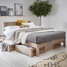 a bed sitting on top of a wooden platform