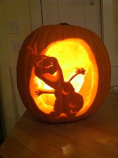 a pumpkin carved to look like a cartoon character