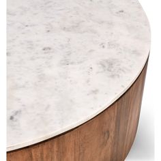 a marble top coffee table with wooden base