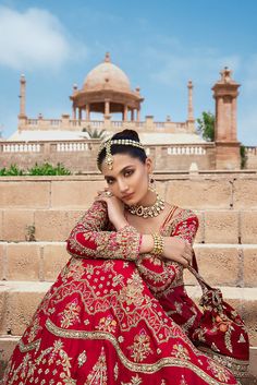 Pakistani Red Dress in Raw Silk Gown Style for Bride is an embellished masterpiece that wins everyone's hearts at the very first glance with its charm and elegance. Kamdani, zardosi, and Resham make this beautiful Pakistani Bridal Dress your priority for the wedding. Pakistani Bridal Gown Pakistani Bridal Gown in an alluring red shade comes in premium raw silk fabric and is emblazoned with luxury designs and gold work. This Pakistani Red Dress is hand-embellished with lavish details of zardosi, Pakistani Red Dress, Raw Silk Gown, Gown Pakistani, Pakistani Gown, Pakistani Bridal Lehenga, Wedding Dresses Pakistani, Bridal Mehndi Dresses, Pakistani Bridal Dress, Mehndi Dress