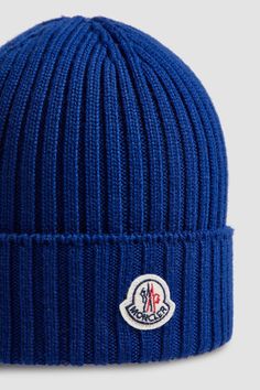 A mid-weight knit, this beanie provides warmth during daily walks and outdoor playtime. The woolen accessory is embellished with a logo patch. Blue Casual Beanie For Cold Weather, Casual Blue Beanie, Blue Wool Beanie, Blue Casual Winter Beanie, Blue Wool Knitted Beanie, Outdoor Blue Knitted Beanie, Casual Wool Hat With Embroidered Logo, Blue Wool Hat For Winter, Winter Wool Hats With Embroidered Logo