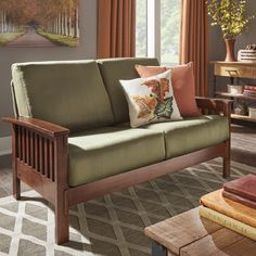 a living room scene with focus on the couch and coffee table in the foreground