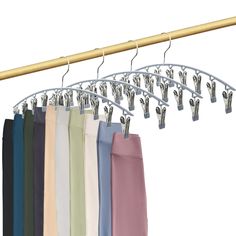 an image of clothes hanging on a rail with clips and pants hanger in the background