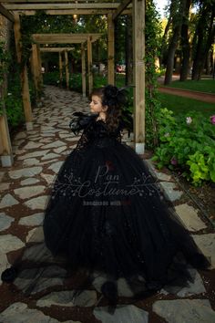 Now our magnificent Queen of Night, a shining black star, as elegant as a black swan... This gorgeous dress is perfect for Halloween, birthdays, theme parties and any other occasions for toddlers and girls. It is handmade of highest quality velvet, French lace, dream tulle, crystal tulle, glittering tulle with a built in petticoat and embellished with feather boa, brooch and fabric handmade roses. We primarily make custom dresses and beside that we have our own standard sizes based on US Numeric Vampire Queen Dress, Black Princess Dress, All Black Halloween Costume, Queen Of Night, Black Dress Halloween Costume, Evil Queen Costume, Night Costume, Halloween Birthdays, Stylish Black Dress