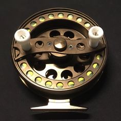 a fishing reel with two candles on it