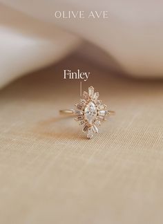 an engagement ring with the name finley on it