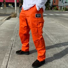 These are a dope anchor for a fly fit. Test your creativity and see what you can put together with these. The AYV Classic Rectangle Patch above the left cargo pocket is the stamp of approval. You can adjust the bottoms and the waist. Fully functional flyness. Stamp Of Approval, Orange Neon, Pants Large, Cargo Pocket, Character Outfits, Small Waist, Cargo Pants, Parachute Pants, Camo