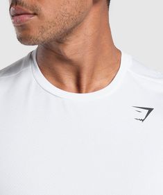 REDEFINING YOUR POTENTIAL The Arrival Regular Fit T-Shirt has all the performance of the original, with a little extra freedom to move. With all the fundamental features you need to perform your best - including sweat-wicking capabilities, perforated fabrics and near-weightless fits - we’ve just increased the sizing for a more casual look and spacious fit. - Regular fit- Lightweight material- Sweat-wicking- Straight hem- Set-in sleeves and crew neck- Heat-sealed Gymshark logo to chest- 100% Polyester- Model is 6'0" and wears size M- SKU: A2A1J-WBBM White Cotton Running Activewear, White Breathable Workout T-shirt, White Go-dry Sportswear T-shirt, White Technical Athletic Fit Tops, White Athletic Fit Technical Tops, White Go-dry T-shirt For Light Sports, White Athletic Fit T-shirt For Workout, White Athletic Fit Crew Neck T-shirt, White Sportswear T-shirt For Training