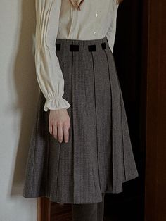 This product is an Autumn Grid Woolen Pleated Skirt, meticulously designed to showcase a blend of classic style with a preppy twist. The skirt features sharp pleats that provide a structured yet flowy movement, and it's accentuated with a detailed grid pattern that offers a textured visual appeal. It's finished with a clean waistband, enhancing the skirt's elegant form while ensuring a comfortable fit.This Autumn Grid Woolen Pleated Skirt boasts precise pleating, which creates a timeless, sophis Fall Office Mini Pleated Skirt, Classic A-line Pleated Skirt For Fall, Classic Pleated Skirt For Fall, Classic Pleated Hem Skirt, Classic Pleated Skirt With Pleated Waist, Elegant Mini Pleated Skirt For Fall, Classic Fall Skirt With Accordion Pleats, Fall Preppy Pleated Lined Skirt, Classic Relaxed Fit Skirt With Pleated Hem