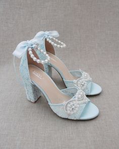 "Fun and flirty lace block heel sandals with pearl appliques. Perfect for weddings, parties, or any special occasion. DETAILS: HEEL HEIGHT: 3.6 inches COLORS AVAILABLE: Ivory, White and Light Blue UPPER: Synthetic upper and lining MATERIALS: Manmade outsole STYLE NAME: FAITH SIZE FIT: RUNS LARGE Not sure of which size to purchase? Shoes measurements are as follow: (Please note measurements taken the length of inside of shoe from toe to heel) SIZE 5 - 9.25\" SIZE 6 - 9.50\" SIZE 7 - 9.75\" SIZE 8 Spring Party Sandals With Lace, Spring Party Lace Sandals, Summer Lace Heels With Block Heel, Lace Block Heel Party Shoes, Lace Block Heel Party Heels, Summer Lace Block Heel Heels, Lace Block Heels For Party, Party Lace Block Heels, Lace Ankle Strap Sandals For Formal Occasions