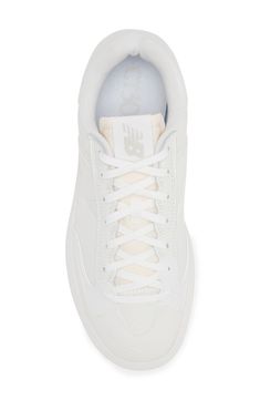 Inspired by a day on the court, this low-top sneaker is built with cushioning and arch support for comfort in every stride. Lace-up style Leather and textile upper/synthetic lining/rubber sole Imported Sporty Air-cushioned Tennis Sneakers, Sporty Tennis Sneakers With Air Cushioning, White Synthetic Athleisure Sneakers, White Lace-up High-top Tennis Sneakers, New Balance Low-top Basketball Shoes With Cushioned Footbed, White Sneakers With Cushioned Athletic Fit, White Athletic Fit Sneakers With Cushioned Footbed, Athleisure Low-top Tennis Sneakers, White Cushioned Athletic Fit Sneakers