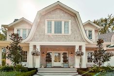 a house with white trim and two story windows