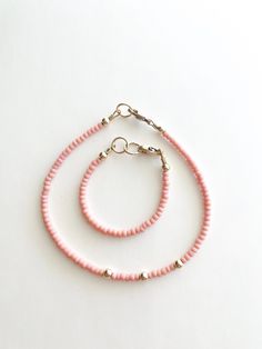 Our "Poppy Pink"  is made with quality Czech seed beads and 14k gold filled lobster clasp, wire, and extender that will resist most wear and tear, with the right care.  These are rare pink vintage findings! Our size chart is just an estimate.  We don't offer returns or cancellations but before leaving a review we'd be happy to help you on any questions on your order. Hypoallergenic Pink 14k Gold Filled Jewelry, Adjustable 14k Gold-filled Jewelry With Spacer Beads, Adjustable 14k Gold Filled Beaded Bracelets With Spacer Beads, Adjustable Pink Gold Beaded Bracelets With Round Beads, Adjustable Pink Gold Beaded Bracelet With Round Beads, Adjustable Coral Jewelry With Tiny Beads, Adjustable 14k Gold-filled Jewelry With Tiny Beads, Pink Heishi Beads Necklace With Tiny Beads, Adjustable Pink Beaded Nickel-free Bracelets