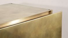 a close up view of a gold colored refrigerator