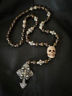 Necklace Profile: 🔱 This Deus Vult Templar Cross Skull Rosary necklace is made of Bronzite stones and high contrasting 925 silver beads. The beads have a diameter of 12 mm which makes this necklace a bold & complementary piece for our statement rings. Bronzite stones are believed to have the properties for increasing self-esteem, promoting decision-making, dispelling negativity and enhancing creativity. 🔱 The antler Guru skull bead measures at 40 mm in height, making it a true eye-catcher piec Long Neckless, Skull Rosary, Rosary Ideas, Rosary Cross, Templar Cross, Cross Rosary, Faith Jewelry, Boys Jewelry, Romantic Goth