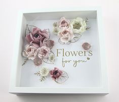 there is a white box with pink and white flowers in it that says flowers for you