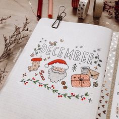 an open christmas planner with santa and other decorations