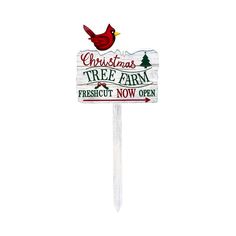 a christmas tree farm sign with a cardinal on it