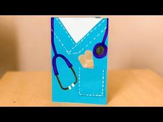 a card case with a stethoscope on it is sitting on a table