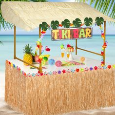 there is a tiki bar on the beach with pineapples and other decorations