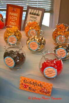 a table topped with glass bowls filled with candy