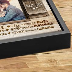 a wooden box with a couple's photo on it and the words love is in the