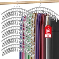 an assortment of clothes hangers and clips hanging on a rail with a price tag