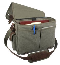 "The Vintage Canvas Messenger makes the perfect Father's Day or graduation gift, this military style bag combines rugged durability with classic style making the perfect gift for the on the go guy in your life. Give a gift they'll use for years to come! This messenger style bag is a favorite guy gift choice and is ideal for Father's Day, Graduation Gifts, or any special gift occasion. PRODUCT DETAILS: - Heavyweight Wash Canvas With Leather Accents - The Messenger Bag Is Ideal For A Laptop Or Oth Mens Messenger Bag For Books, Vintage Canvas Bags, Messanger Bag, Laptop Shoulder Bag, Leather Laptop Bag, The Messenger, Zippered Pouch, Leather Accents, Leather Laptop